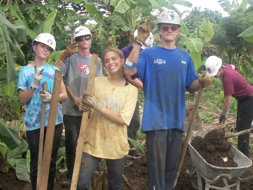 Senior Scott Heaton and friends dig a water trench in the jungles of Samoa to assist the development of nearby towns. They wear decorated hard hats to express themselves and add a fun twist to the hard work. 