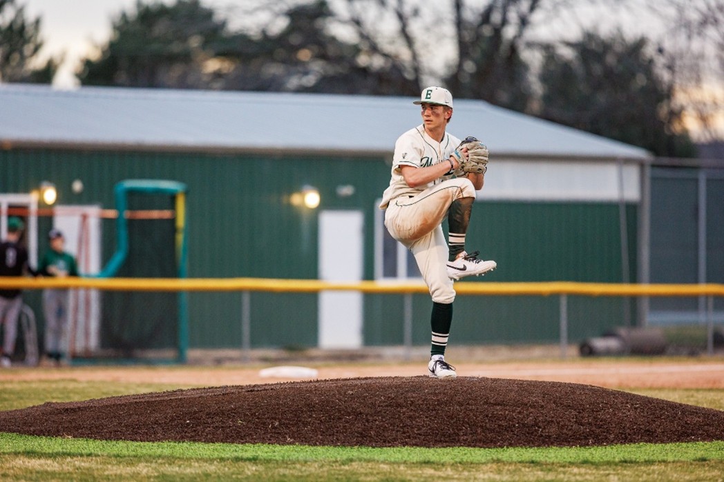 Senior Dallin Snooks locks in and fires his pitch in a game against Skyview High School. Eagle High School takes the victory eight to three.