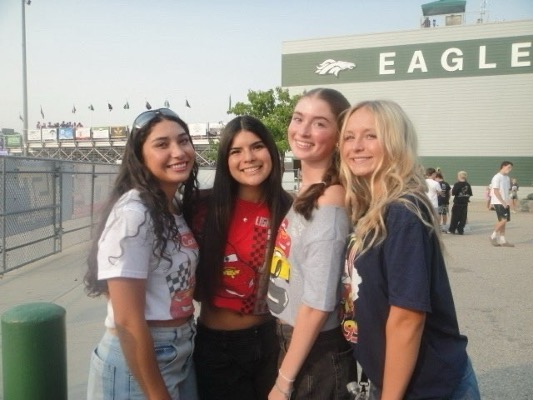 Junior Sofie Baiza, senior Melia Diaz, junior Lauren Damiani and senior Taylor Archer enjoyed dressing up for the Pixar themed football game. They wore “Cars” inspired shirts in line with the theme.  