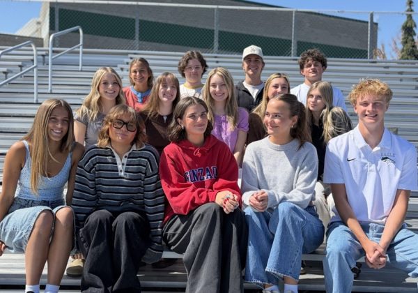 The class of 2026’s newspaper seniors sit in the stands at Eagle High. These same stands are where they attended each football game and sporting event. This class has worked hard this year to put out each issue of “The Stampede” Newspaper.