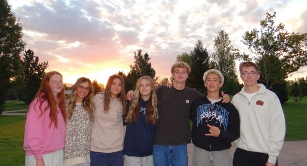 Seniors Audrey Baxter, Ava Sonne, Maddie Dalling, Allyson Godfrey, Ozzie Faulk, Will Anderson and Curtis Hansen (pictured left to right), attend the class of 2026’s Senior Sunrise. These same friends look forward to Senior Sunset as it will end this chapter in their life.