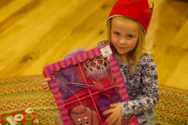 Senior Sylvia Hansen poses with her new Christmas gift. It was one of her favorite toys that she could use to play dress up.