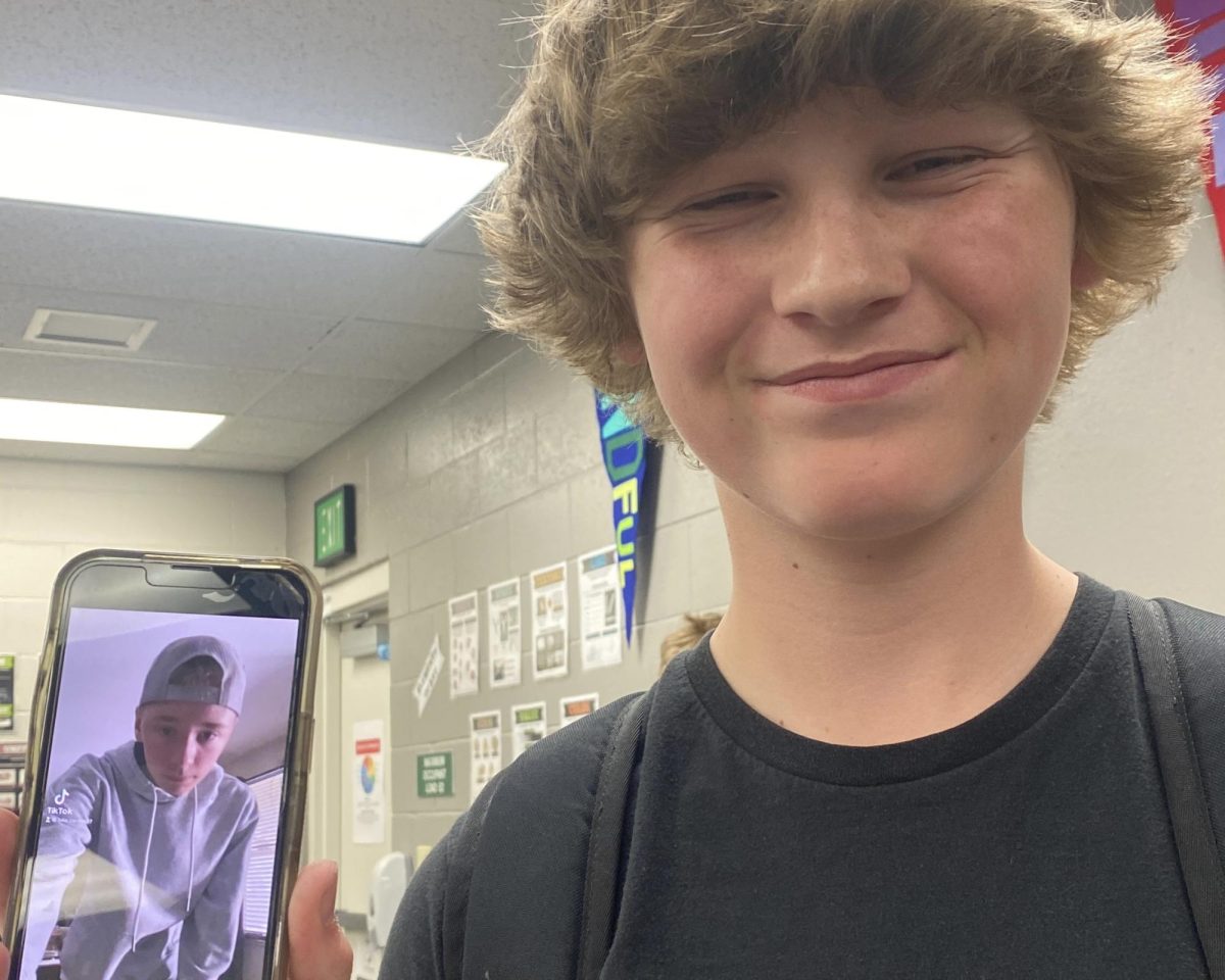 Senior Easton Gothberg shows his Tik Tok feed during his freshman year. His hair was longer than it is now and he enjoyed wearing graphic t-shirts to match his favorite Tik Tok influencers.